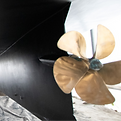 Underneath a boat including antifouling and a shiny prop