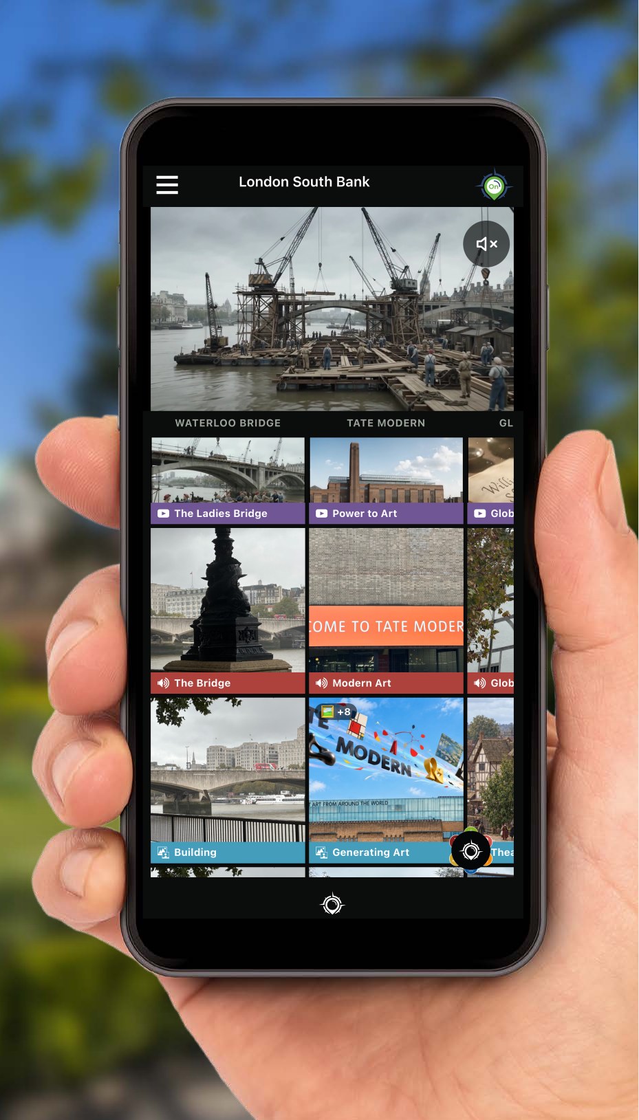 A hand holding a phone showing the Finderz app's London South Bank grid