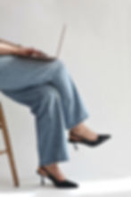 crossed legs with black high heels
