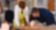 Image of teacher and child in a classroom
