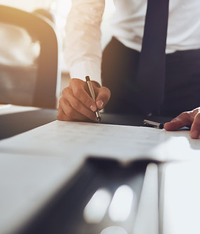 Close up business man signing contract making a deal classic business_edited.jpg