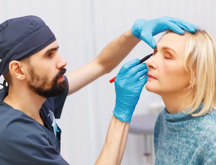 Surgeon and patient before cosmetic eye surgery Merseyside