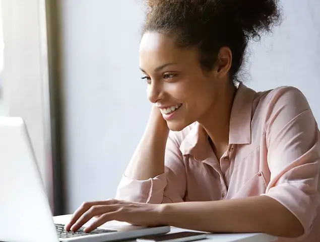 Women on computer after laser eye surgery for reading