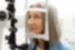 Senior women getting an eye examination at iSIGHT Private to determine the need for private cataract surgery.