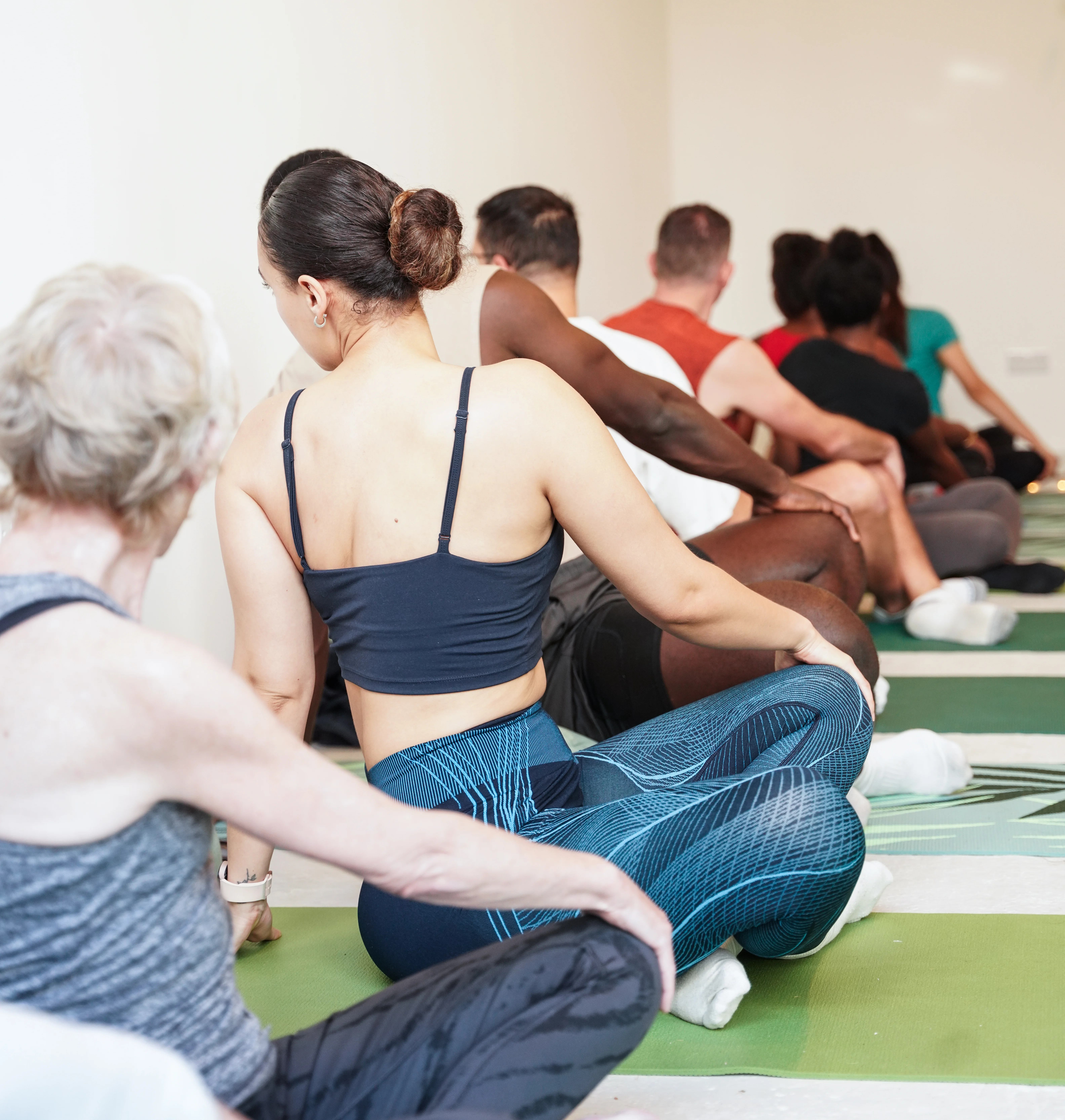 people doing yoga together in a classroom