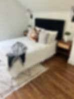 Bedroom wall lights installed above nightstands by Smart Choice Electric