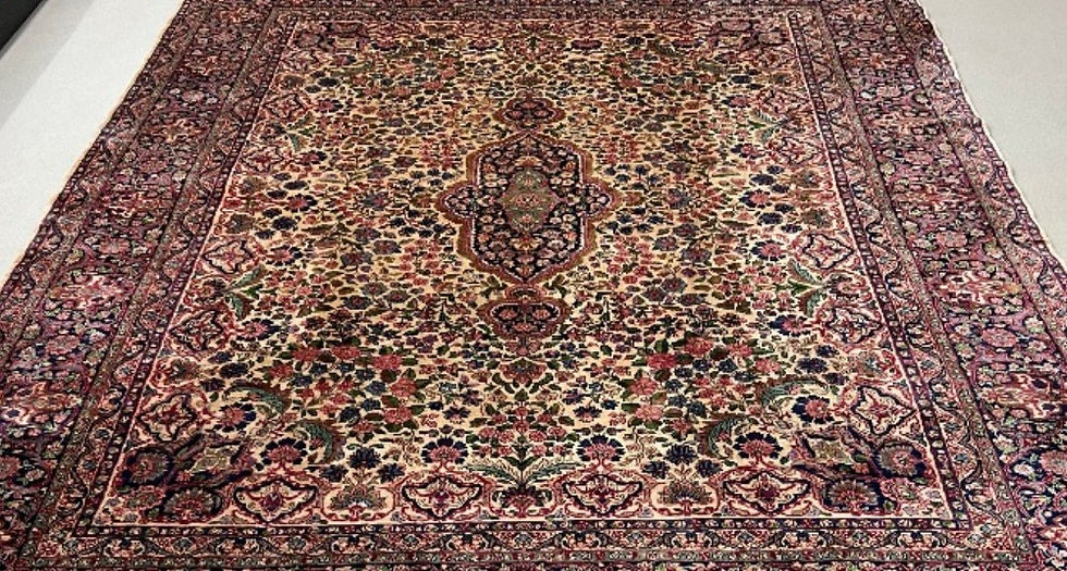 Thumbnail: This Antique Persian rug features a stunning floral pattern on an ivory background.