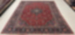 This Antique Persian rug features an elegant medallion design in soft red color, red background, blue borders.