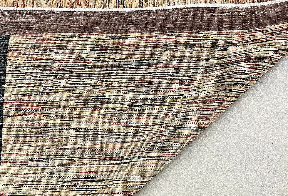 Thumbnail: This oriental rug features a signature Gabbeh design in beautiful brown colors.