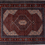 Thumbnail: This Persian rug features a stunning medallion design that adds elegance and sophistication to any room.