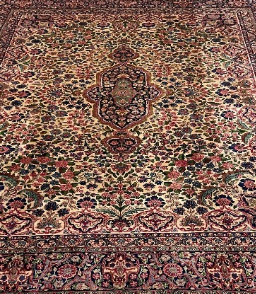 Thumbnail: This Antique Persian rug features a stunning floral pattern on an ivory background.