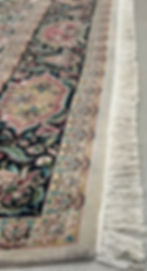 This Pakistani rug features signature William Morris design, cream background, dark borders.