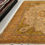 Thumbnail: This Persian rug features a medallion design in a beautiful color combination: soft green, yellow, gold, ivory & blush colors