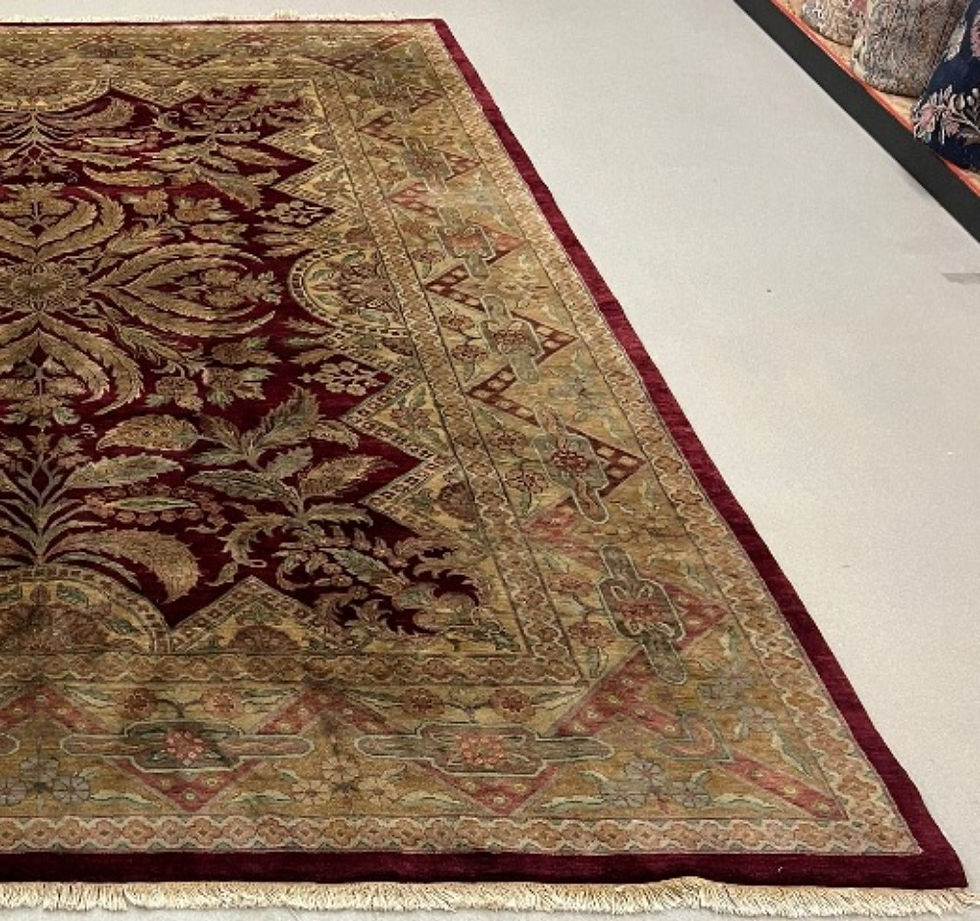 Thumbnail: This India rug features a stunning pattern in tan color on a burgundy background, tan borders.
