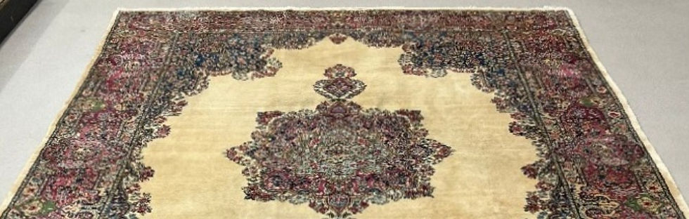 Thumbnail: This Antique Persian rug features a stunning medallion design on ivory background with blush borders.
