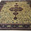 Thumbnail: This Oriental India rug features a striking medallion motif in burgundy and gold colors.