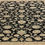 Thumbnail: This Pakistani rug features a beautiful design on a black background with cream borders.