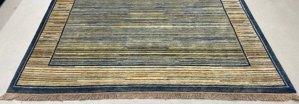 Thumbnail: Persian Gabbeh design originated in Nepal. Gabbeh design features simple design and bold colors.