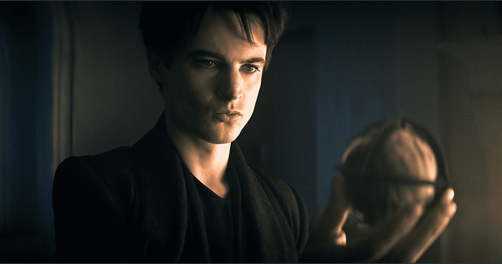 Tom Sturridge as Dream in episode 208 of The Sandman holding an object.