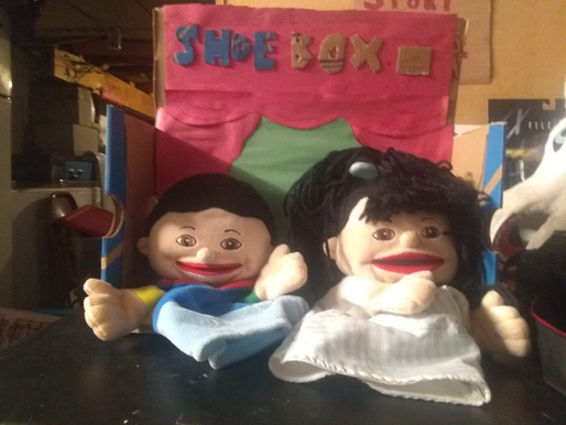 Two puppets slouched