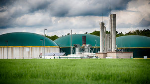 Picture of an anaerobic digestion facility in a green field