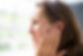 woman holding ear with discomfort