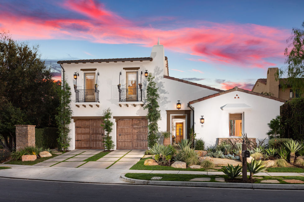 a white house with a wooden garage door