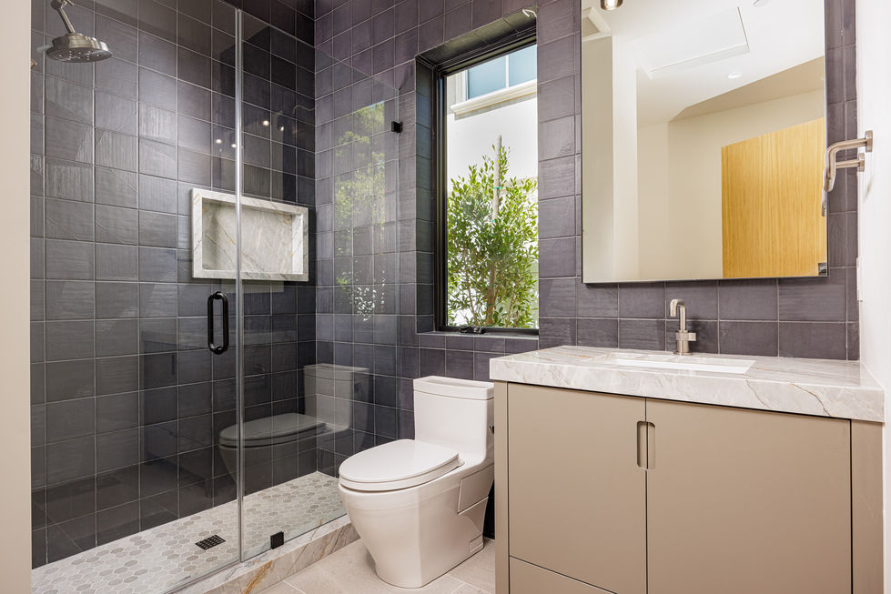 a bathroom with a toilet a sink and a window