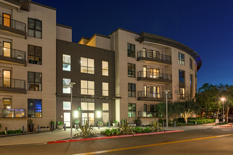 the lennox apartment building is lit up at night