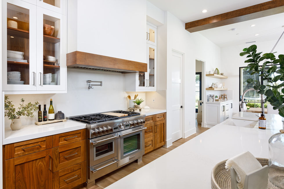 a kitchen with stainless steel appliances and wooden cabinets
