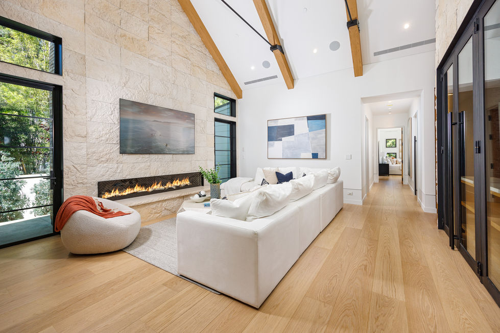a living room with a fireplace and a flat screen tv