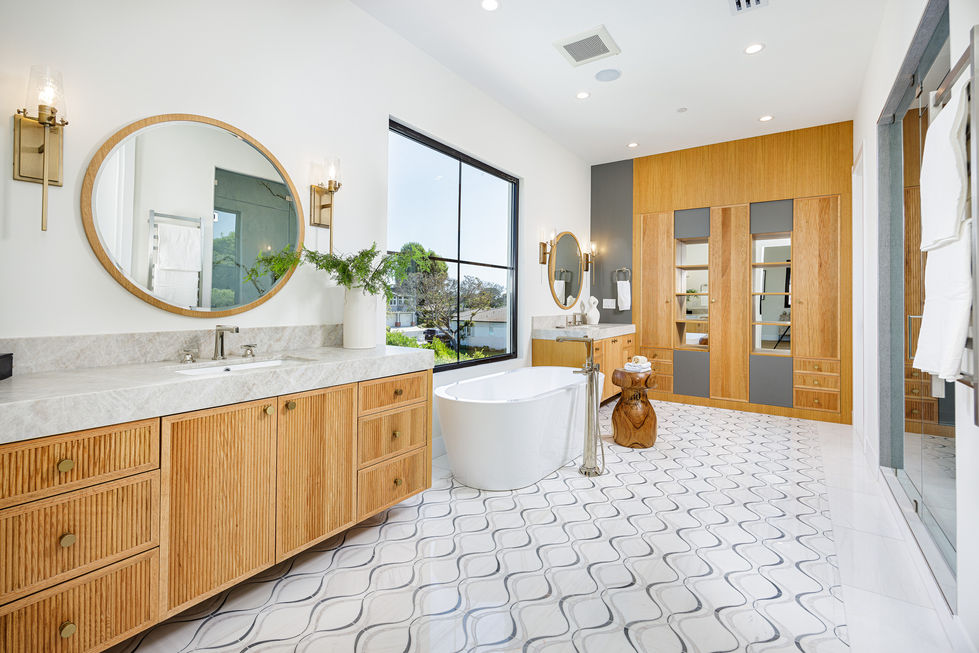a bathroom with two sinks and a bathtub