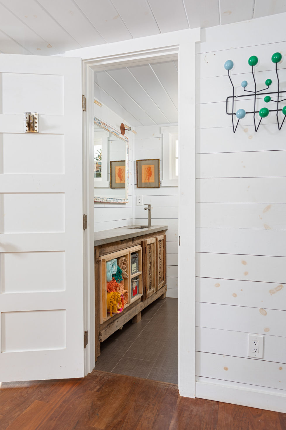 a bathroom with a sink and a mirror on the wall