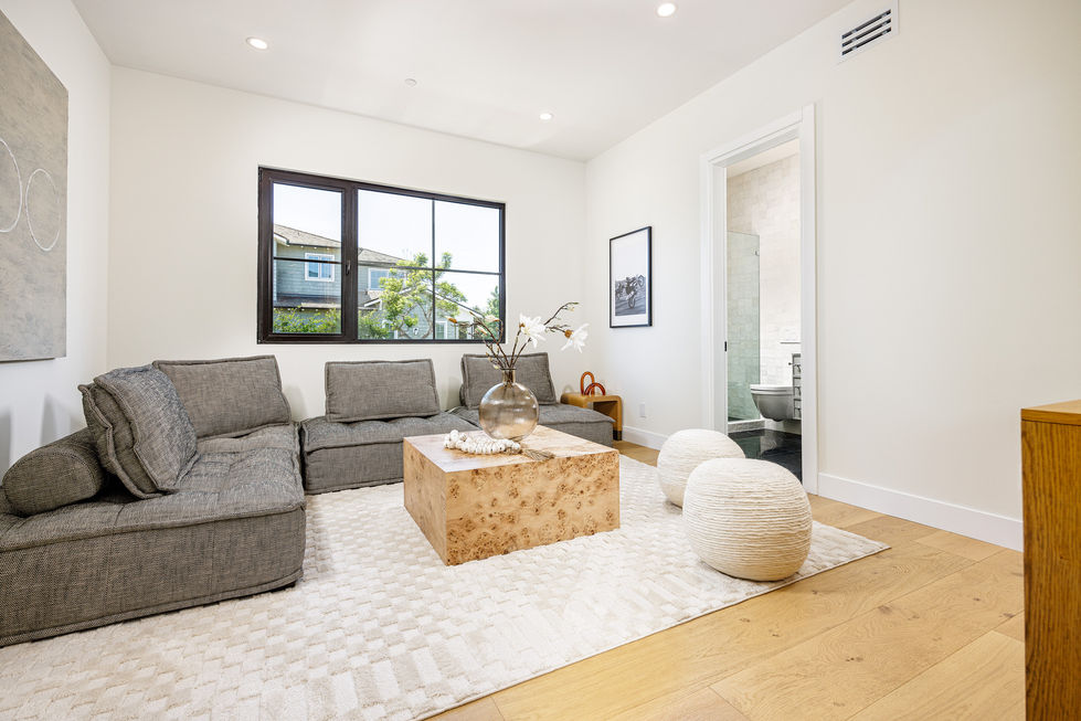a living room with chairs and a coffee table