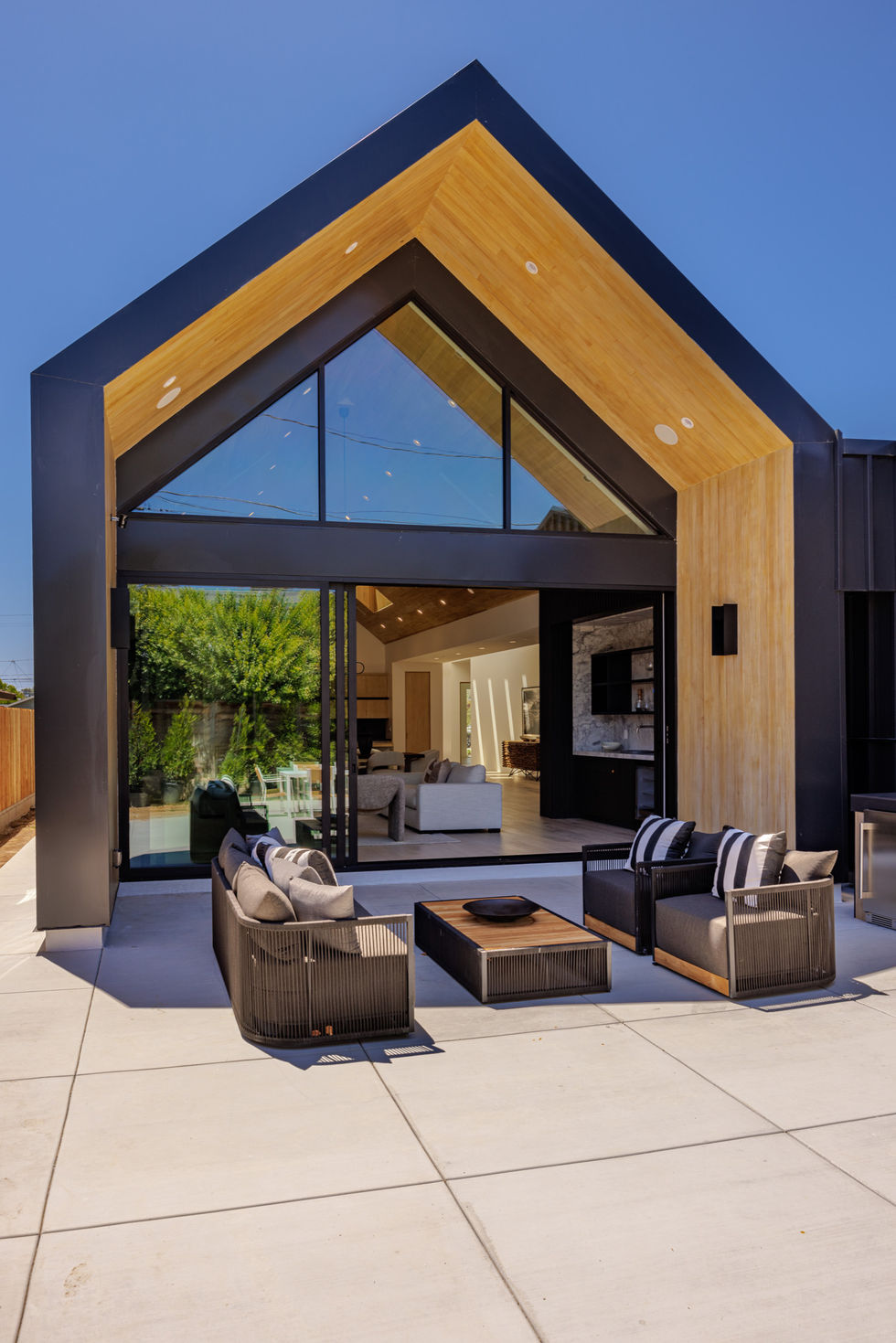 a house with a lot of windows and furniture