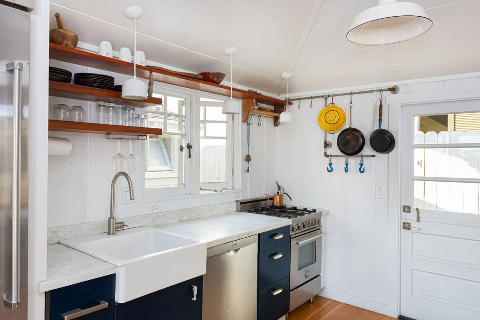 a kitchen with a stainless steel stove and dishwasher