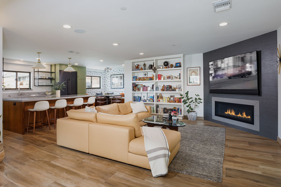 a living room filled with furniture and a fireplace