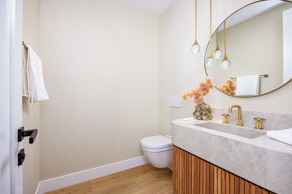 a bathroom with a toilet a sink and a mirror
