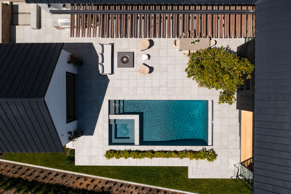 an aerial view of a house with a swimming pool