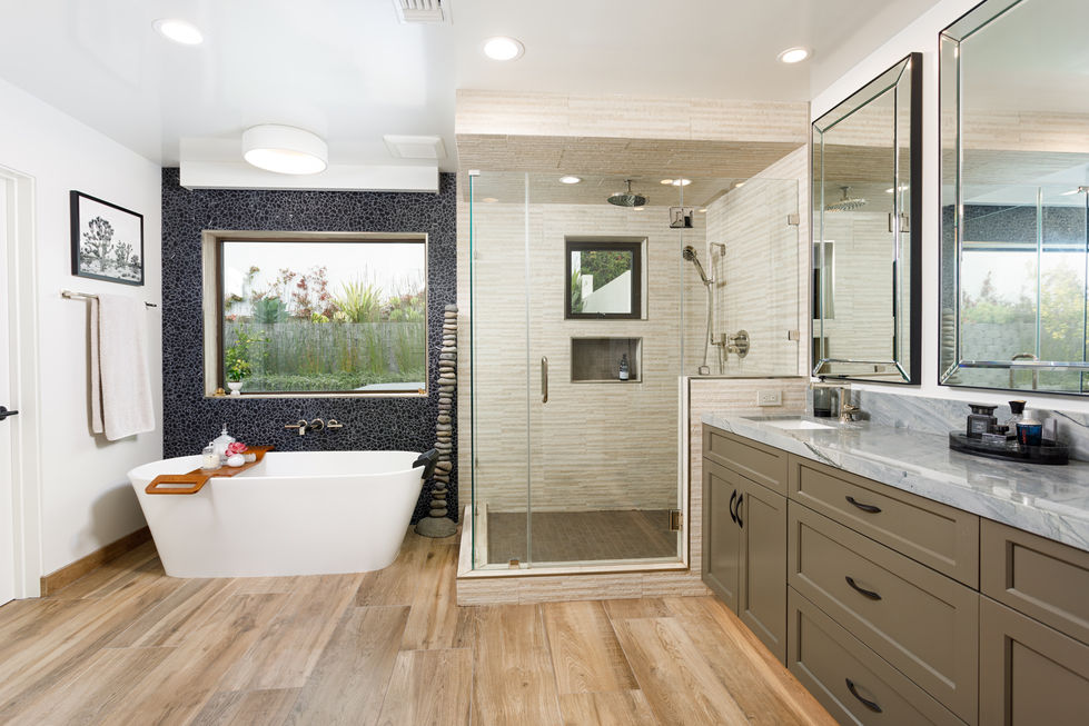 a bathroom with a tub and a walk in shower