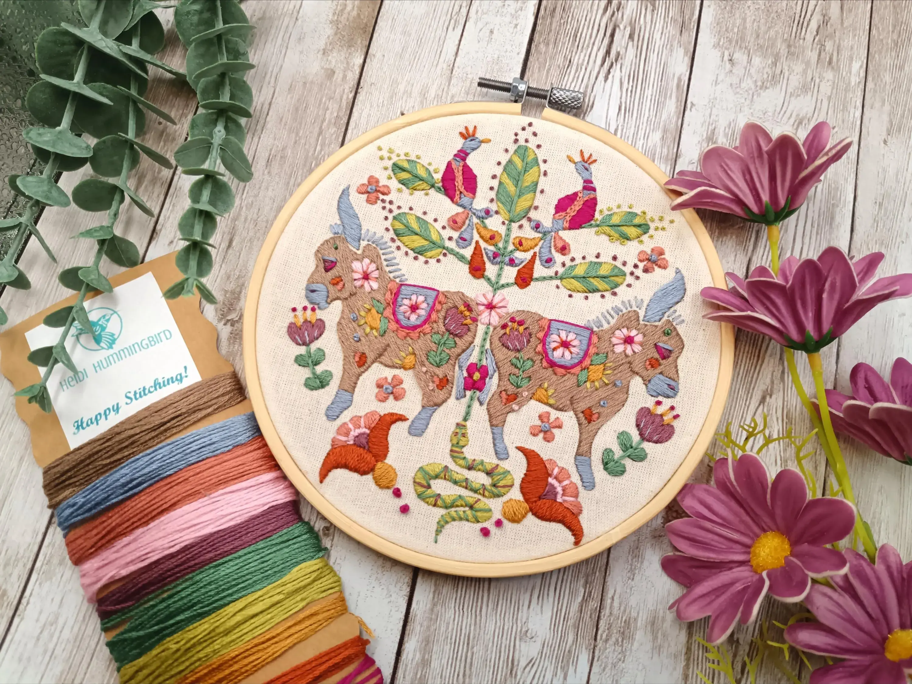 Close up of donkey embroidery with floral folk art pattern