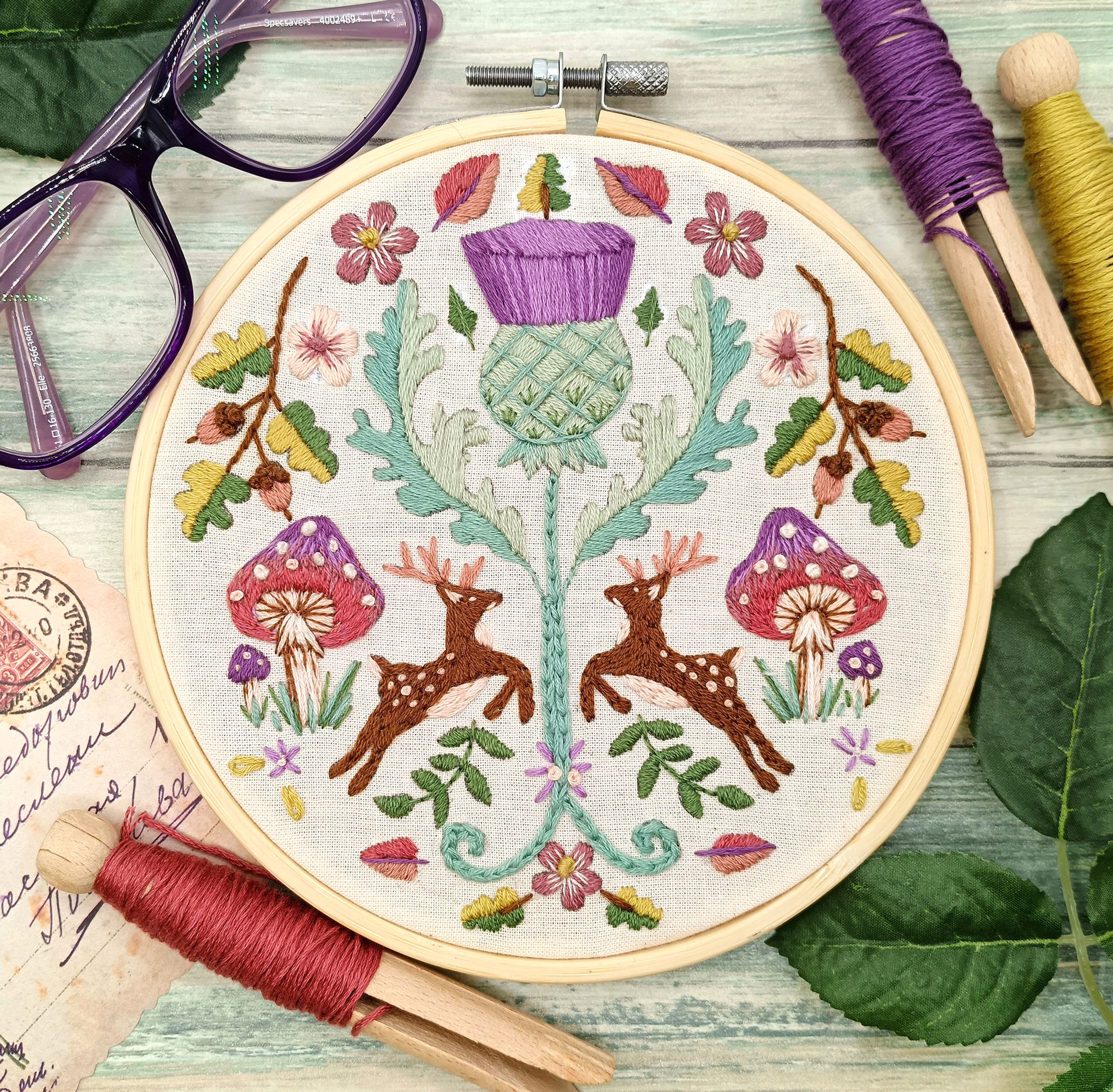 Deer embroidery kit with woodland thistle design and folk art pattern
