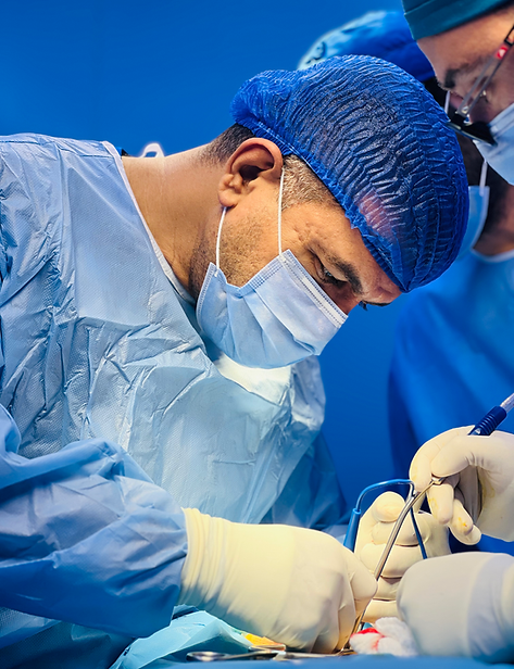 Dr.Ghazwan Hasan during spine fixation surgery
