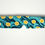 Thumbnail: Teal sleep mask with yellow smiley faces