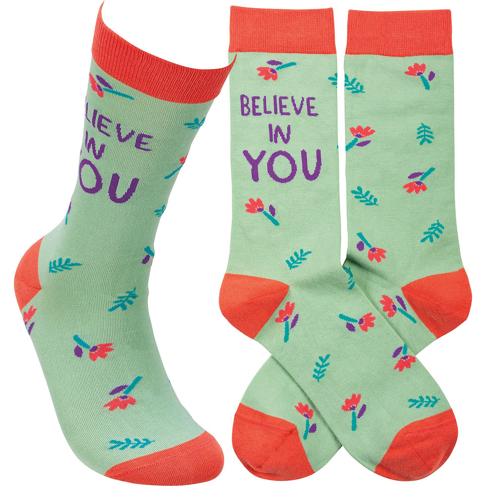 Pastel green socks with "Believe in You" and flowers