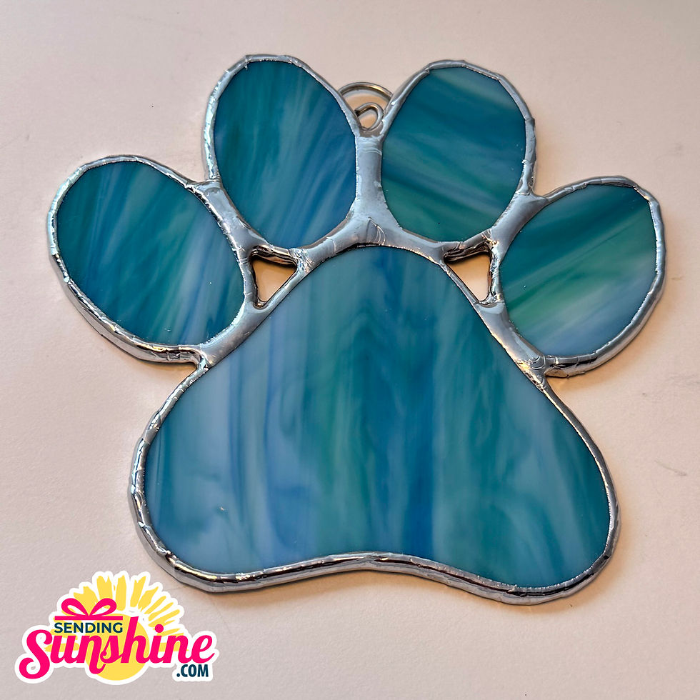 Teal paw print stained glass suncatcher