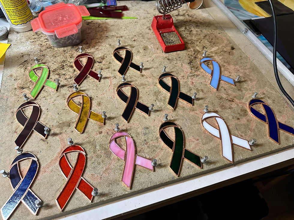 Colorful awareness ribbons arranged on a table