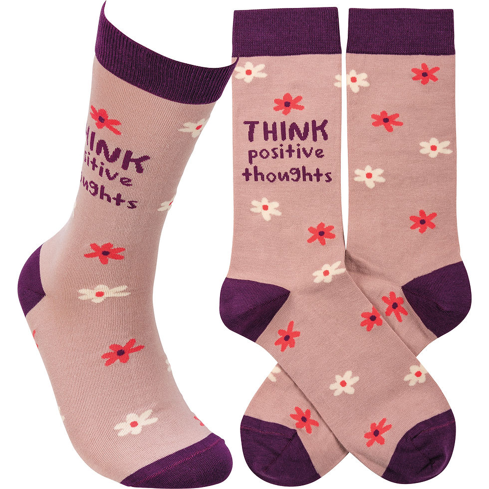 Pink socks with "Think positive thoughts" and flowers