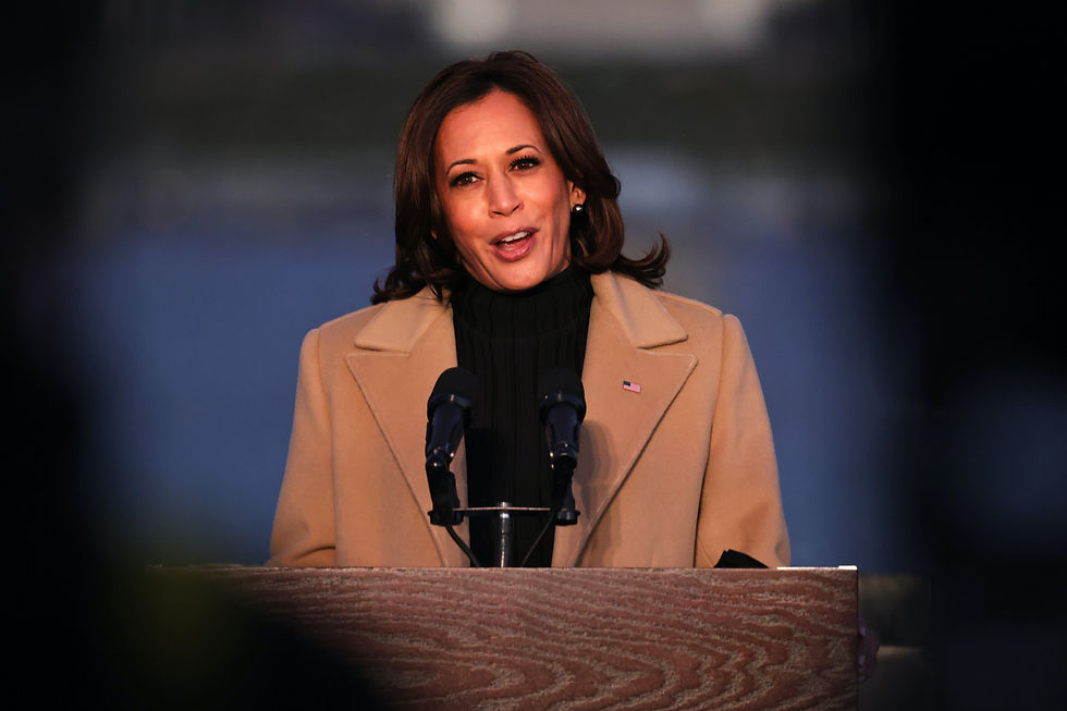 Vice President-elect Kamala Harris speaks at a Covid-19 memorial event in Washington, DC wearing a coat by Pyer Moss. Getty.