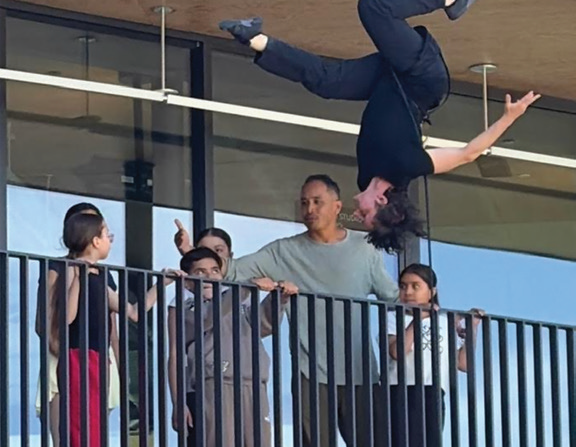 Abad and his students watch one of the BANDALOOP dancers practice for the upcoming EPACENTER performance